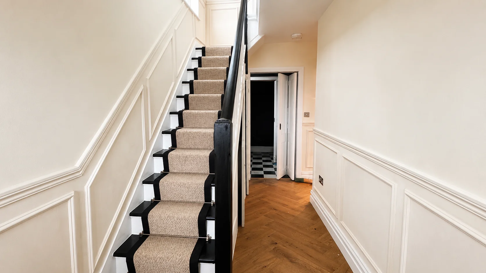 House refurbishment hallway with wall panelling in East London by Chenko Builders